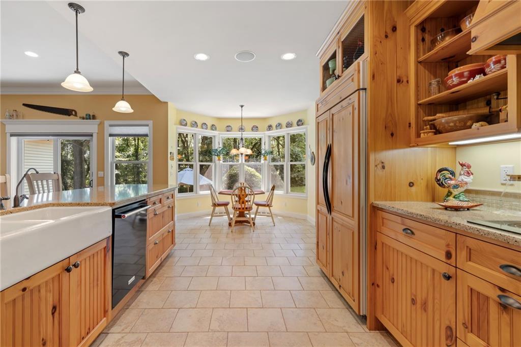 287 Garner Road Edinburg, PA 16116 - Photo 17 of 49 a kitchen with stainless steel appliances granite countertop sink stove top oven and cabinets