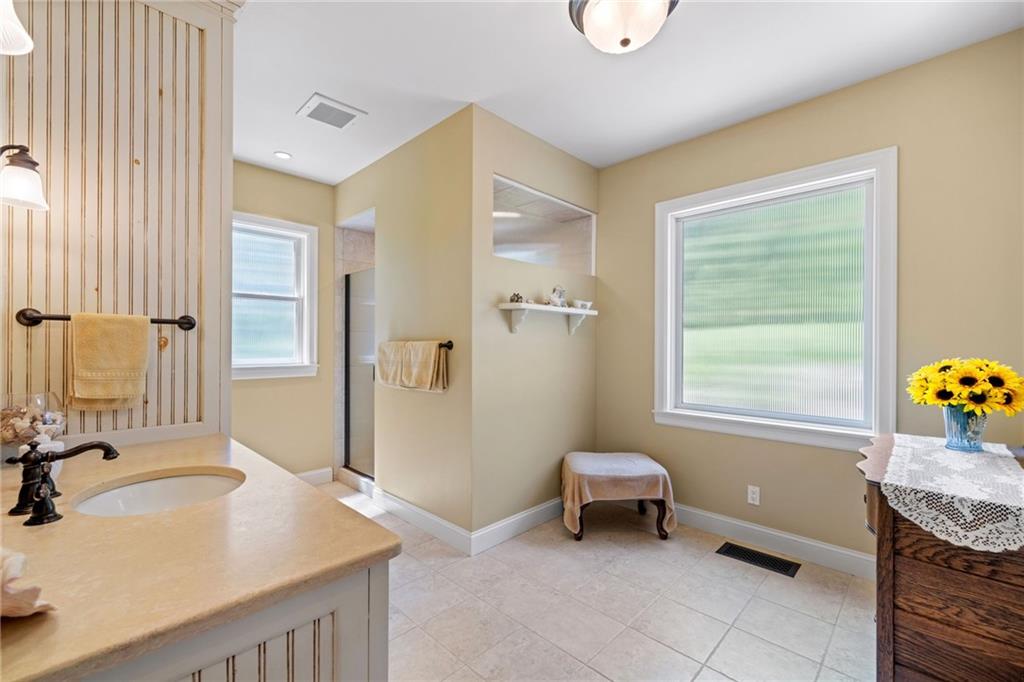 287 Garner Road Edinburg, PA 16116 - Photo 21 of 49 a bathroom with a granite countertop sink and a mirror