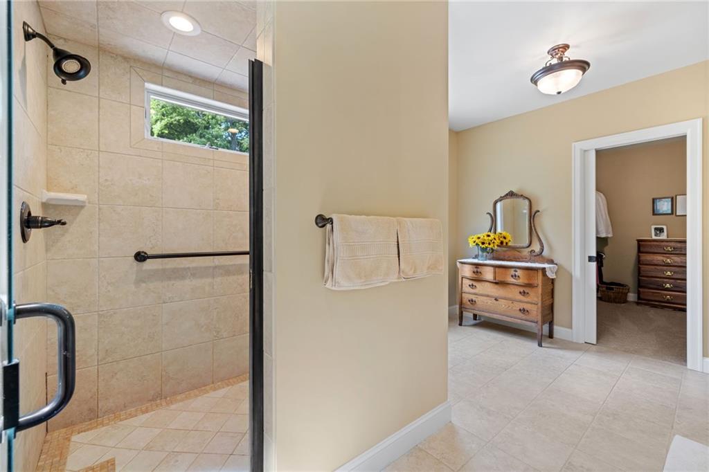 287 Garner Road Edinburg, PA 16116 - Photo 23 of 49 a bathroom with a tub sink and mirror