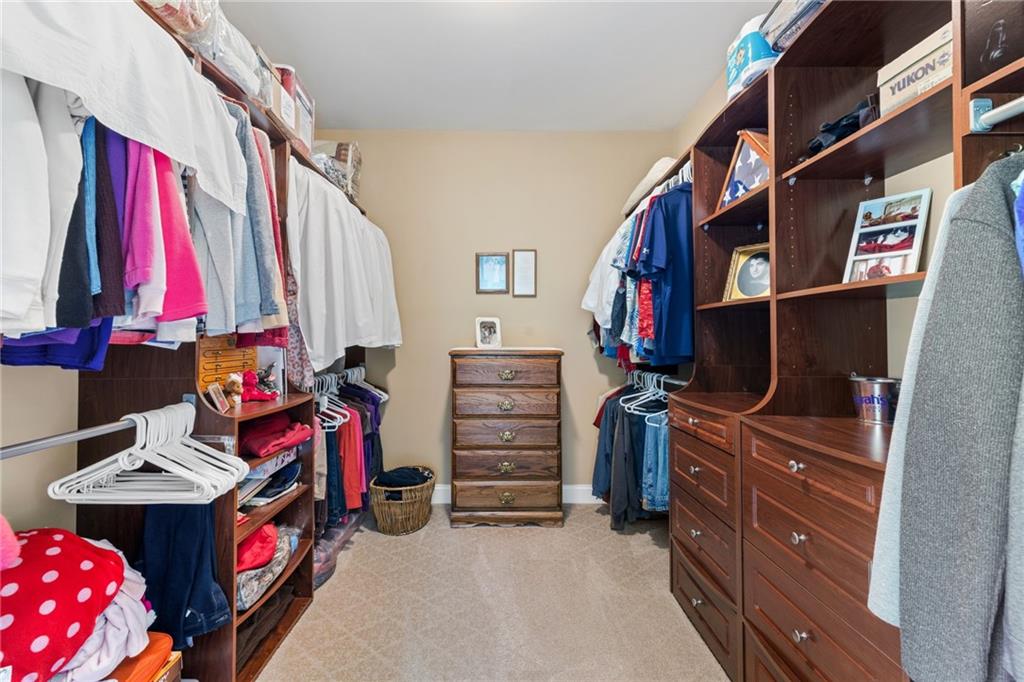 287 Garner Road Edinburg, PA 16116 - Photo 24 of 49 a view of walk in closet with clothes and shoes