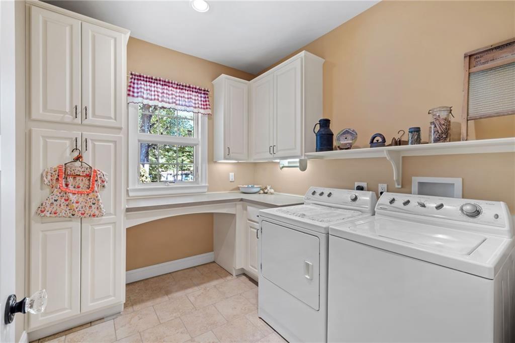 287 Garner Road Edinburg, PA 16116 - Photo 27 of 49 a view of cabinets a sink and a window in a room