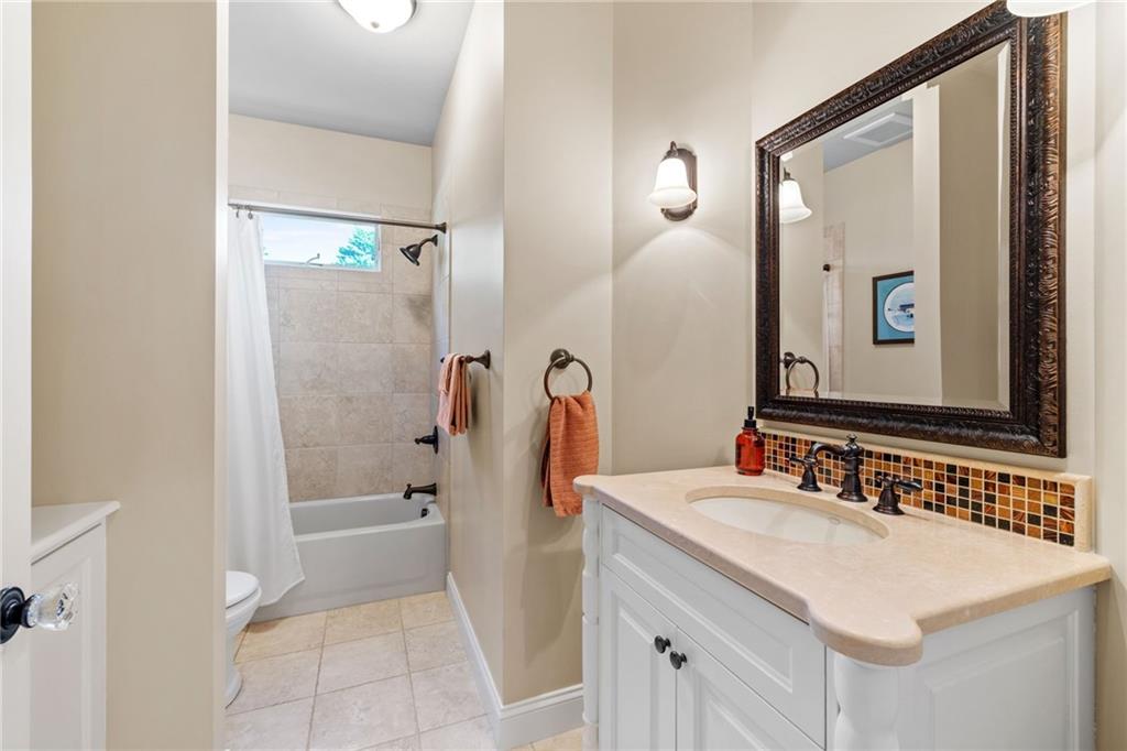 287 Garner Road Edinburg, PA 16116 - Photo 30 of 49 a bathroom with a sink and a mirror