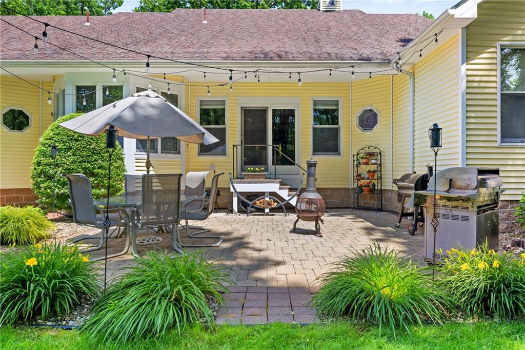 287 Garner Road Edinburg, PA 16116 - Photo 38 of 49 a view of a patio with table and chairs under an umbrella