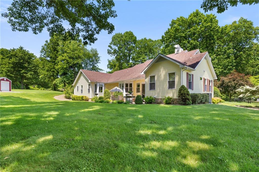 287 Garner Road Edinburg, PA 16116 - Photo 39 of 49 a front view of a house with a garden