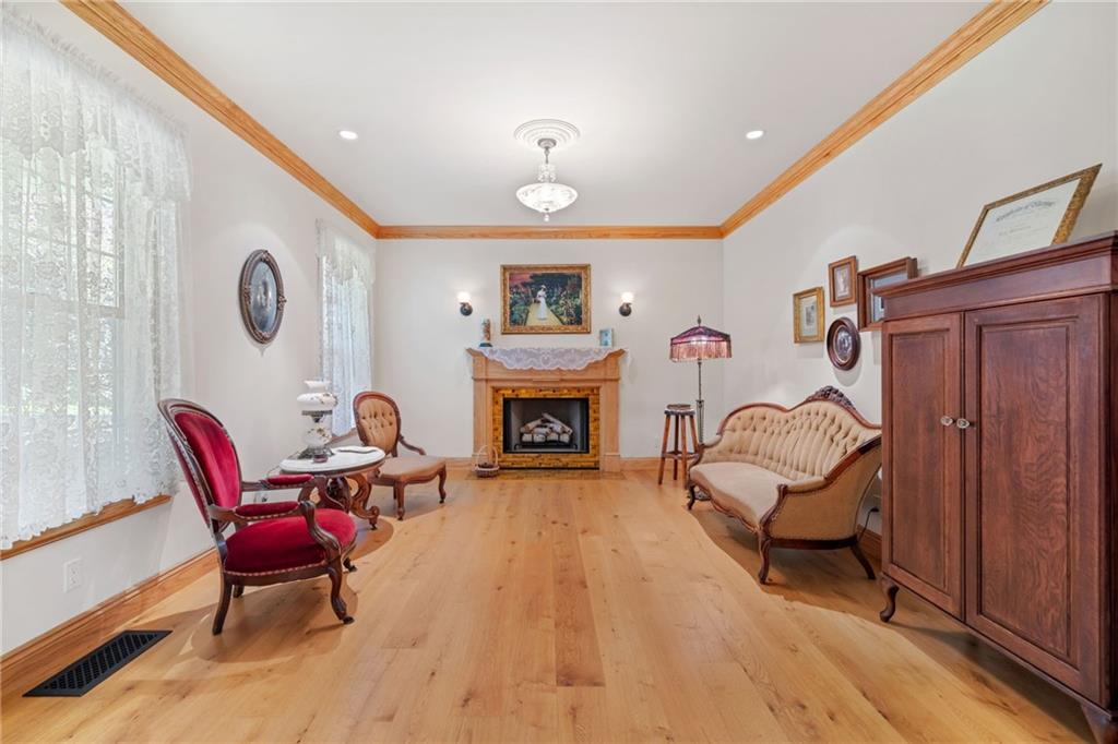 287 Garner Road Edinburg, PA 16116 - Photo 5 of 49 a living room with furniture and a fireplace
