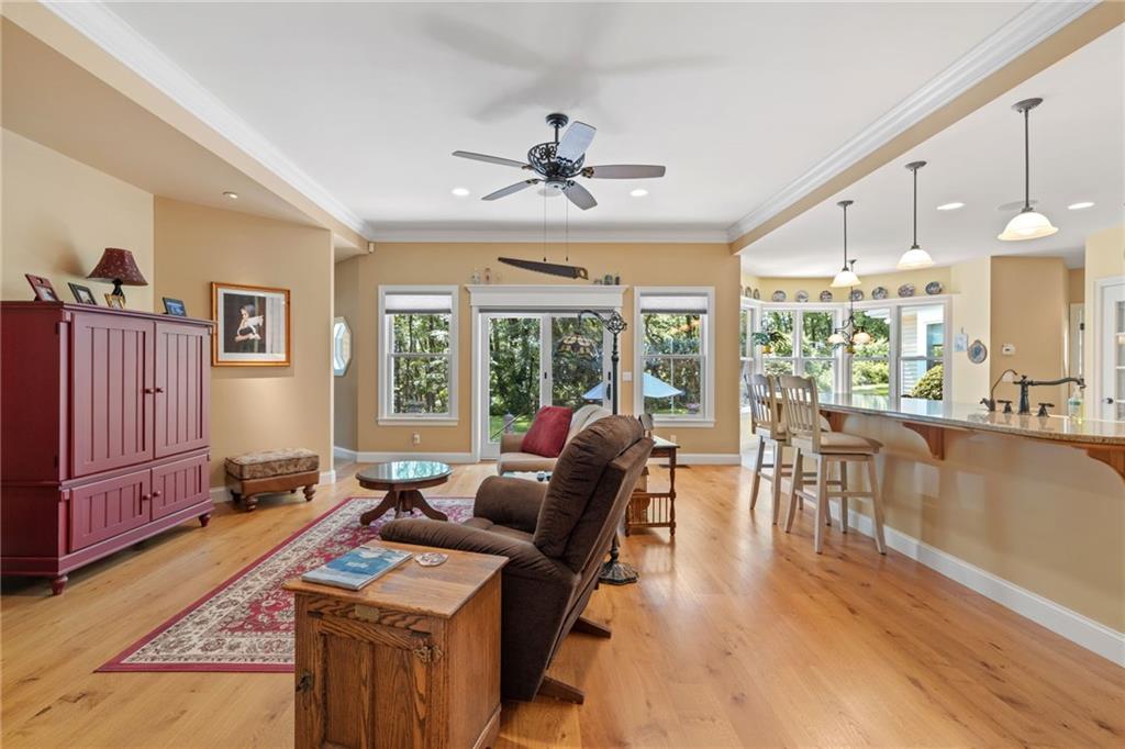 287 Garner Road Edinburg, PA 16116 - Photo 10 of 49 a living room with furniture a fireplace and wooden floor