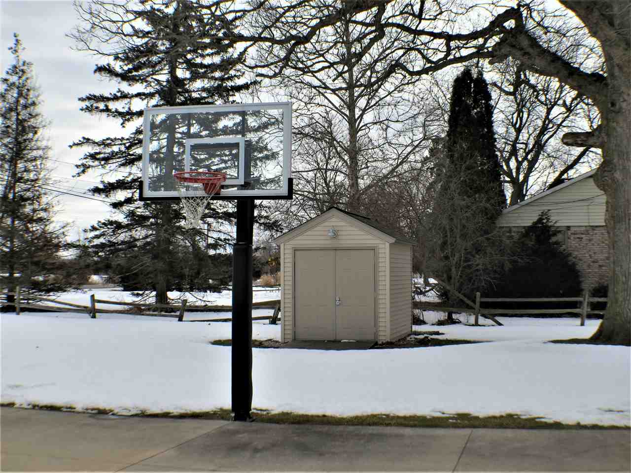1420 South Morrish Road Flint, MI 48532 - Photo 21 of 32 Basketball pole adjusts