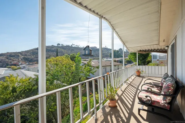 a view of balcony with furniture