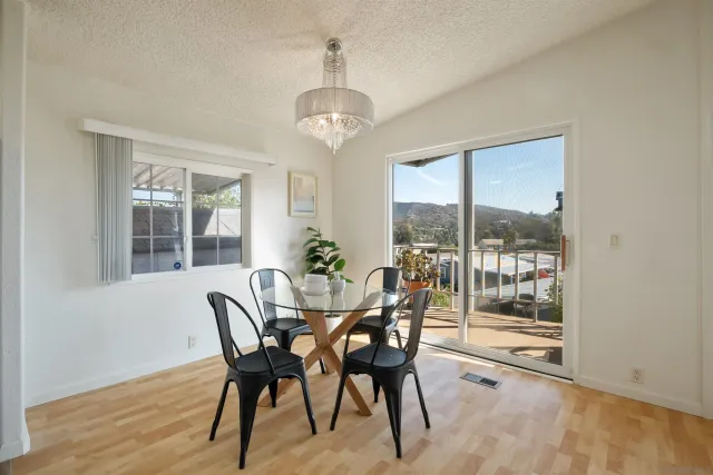 a view of a dining room with furniture window and outside view