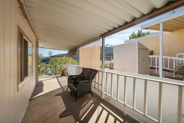 a view of balcony with furniture