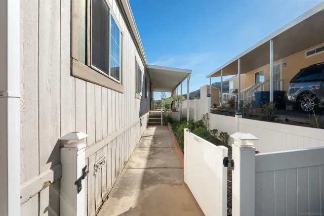 a view of a brick house with large windows