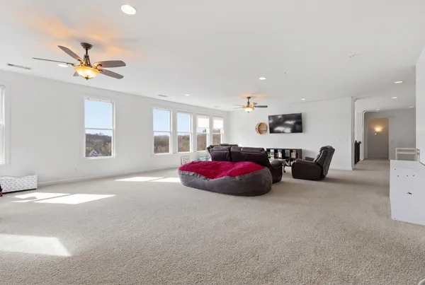 a living room with furniture window and flat screen tv