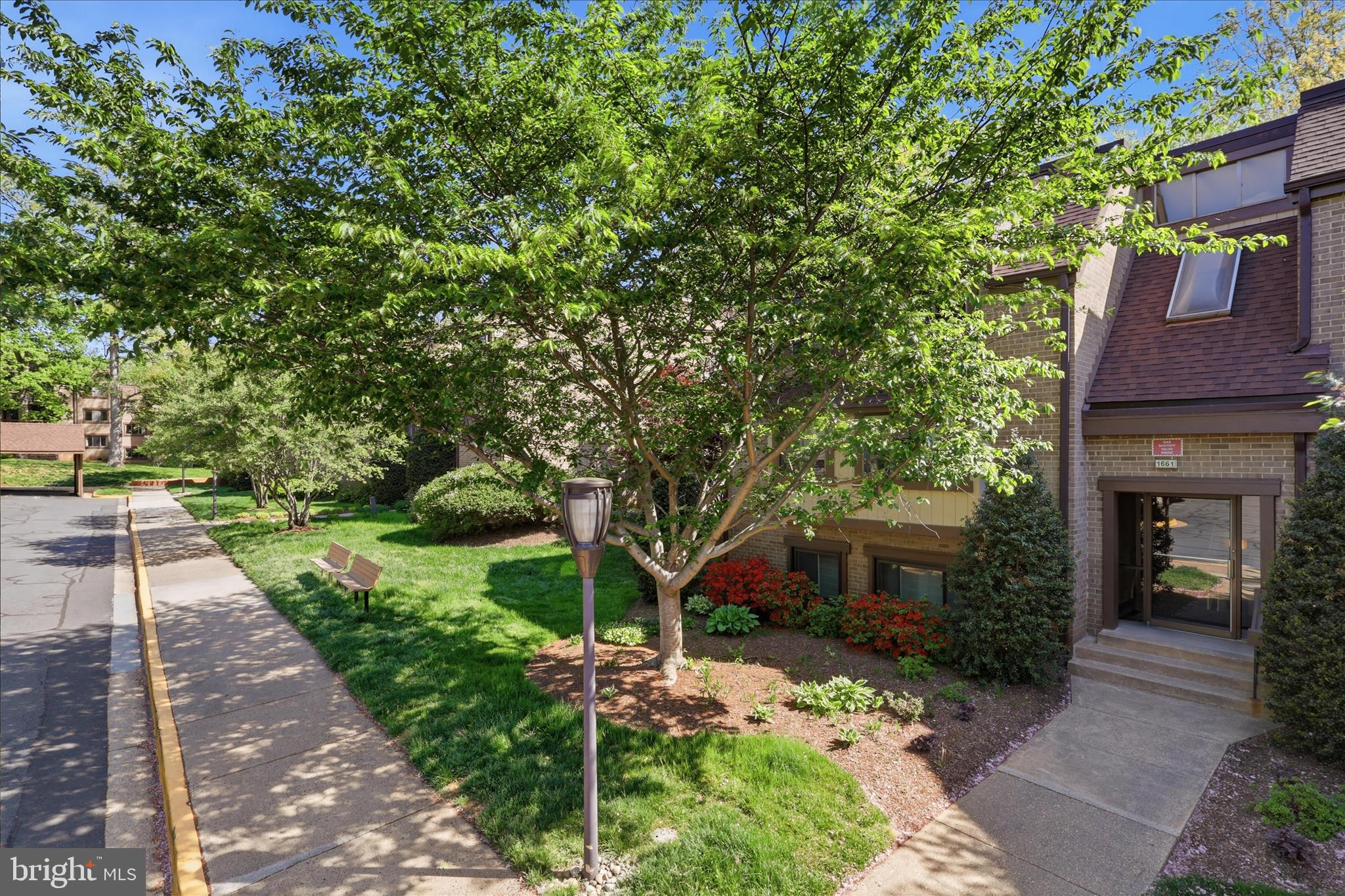 1661 Parkcrest Circle, Unit 5A/300 Reston, VA 20190 - Photo 2 of 22 a front view of a house with a yard
