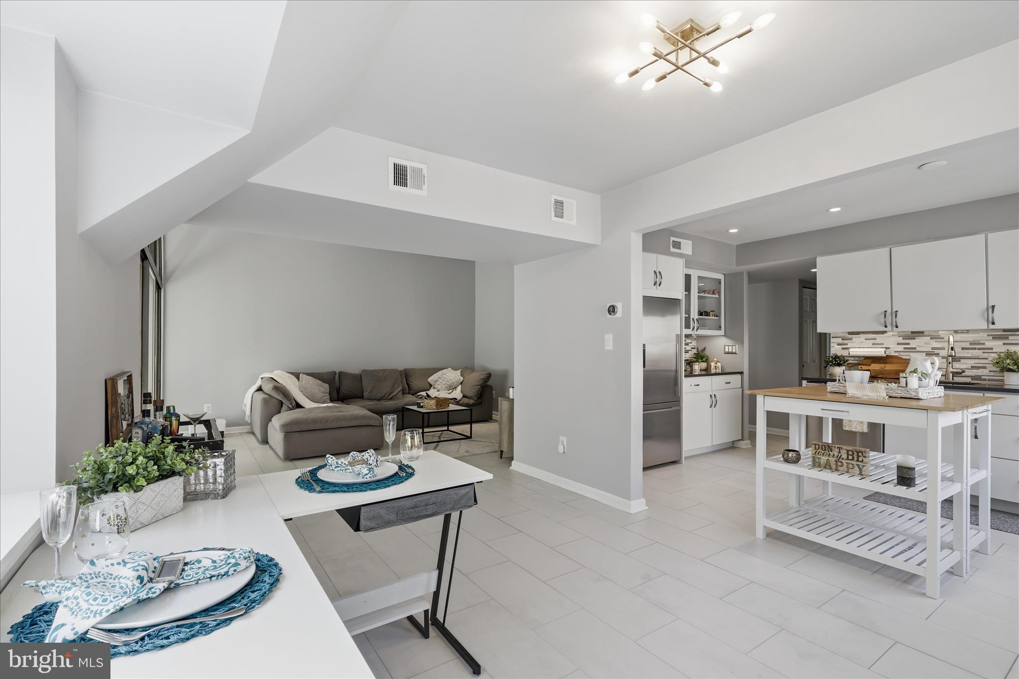 1661 Parkcrest Circle, Unit 5A/300 Reston, VA 20190 - Photo 6 of 22 a kitchen with stainless steel appliances kitchen island granite countertop a sink and cabinets