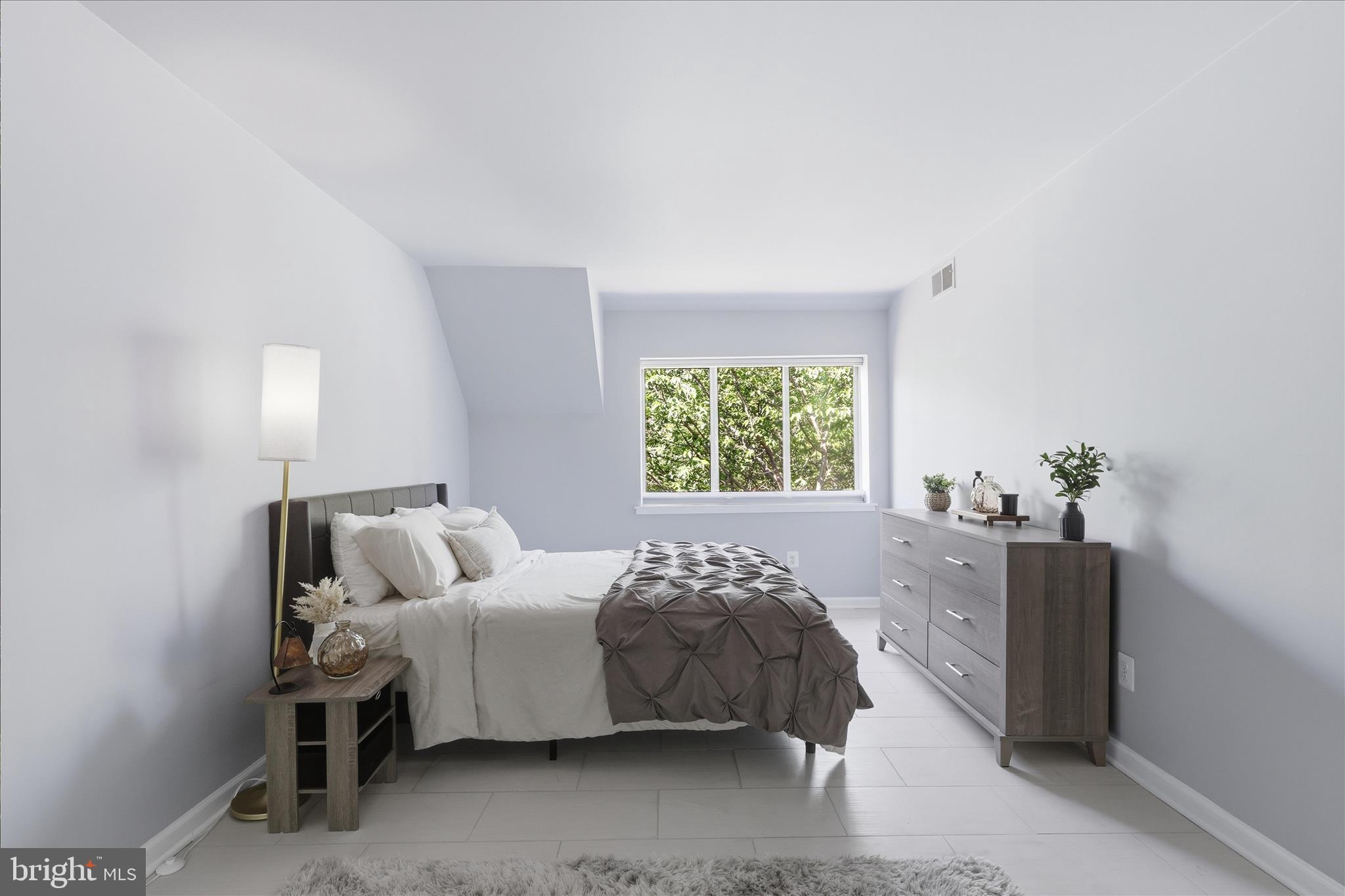 1661 Parkcrest Circle, Unit 5A/300 Reston, VA 20190 - Photo 10 of 22 a bedroom with a bed and a window