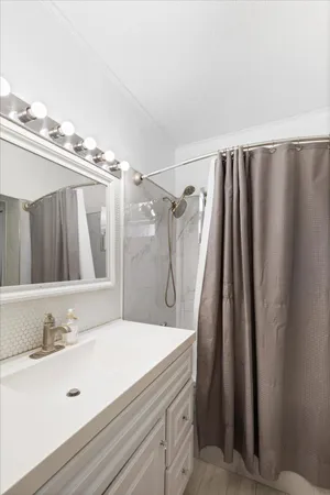 a bathroom with a double vanity sink and mirror
