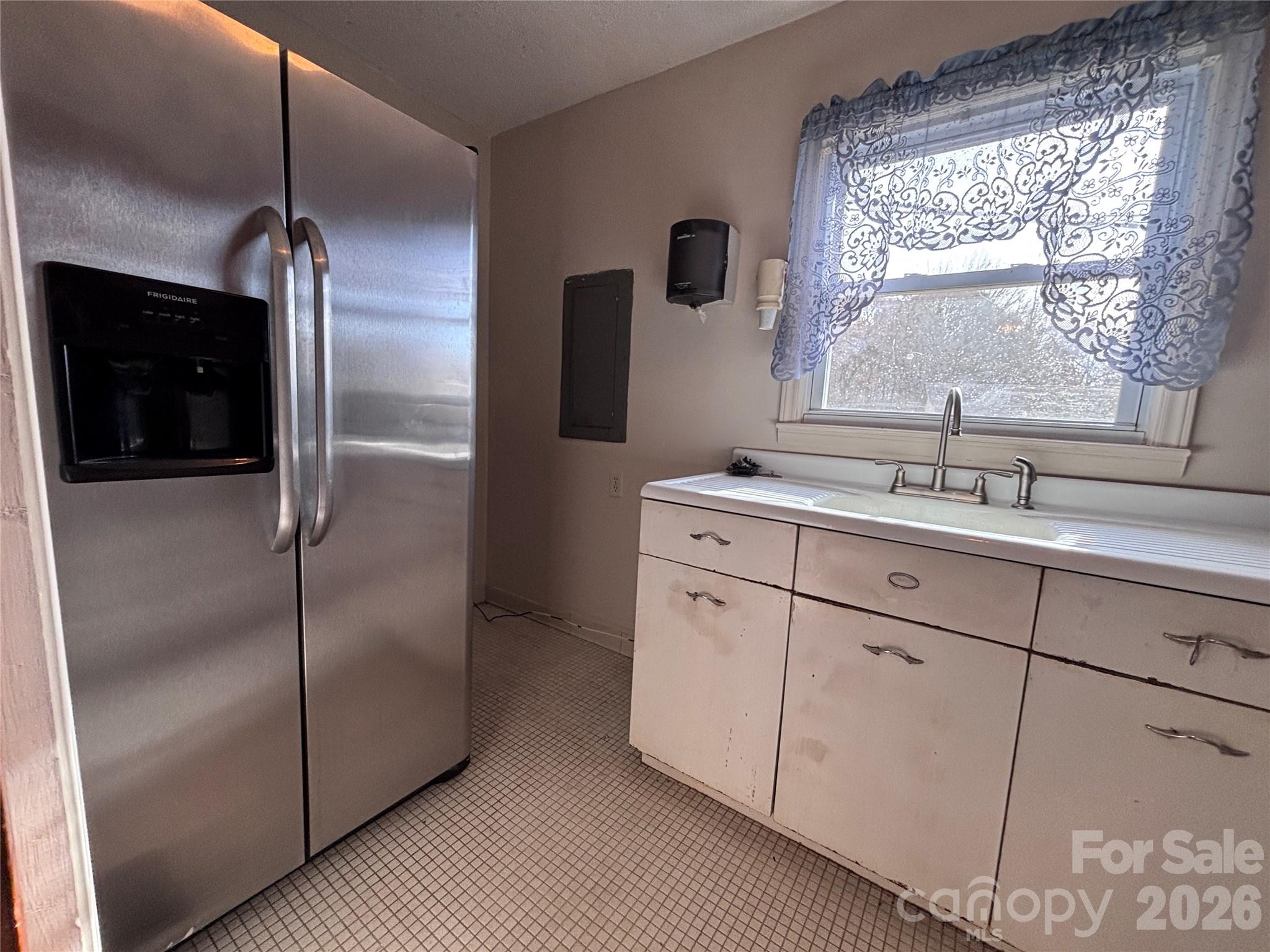 14740 Hatley-Burris Road Oakboro, NC 28129 - Photo 14 of 24 a kitchen with a refrigerator and a sink