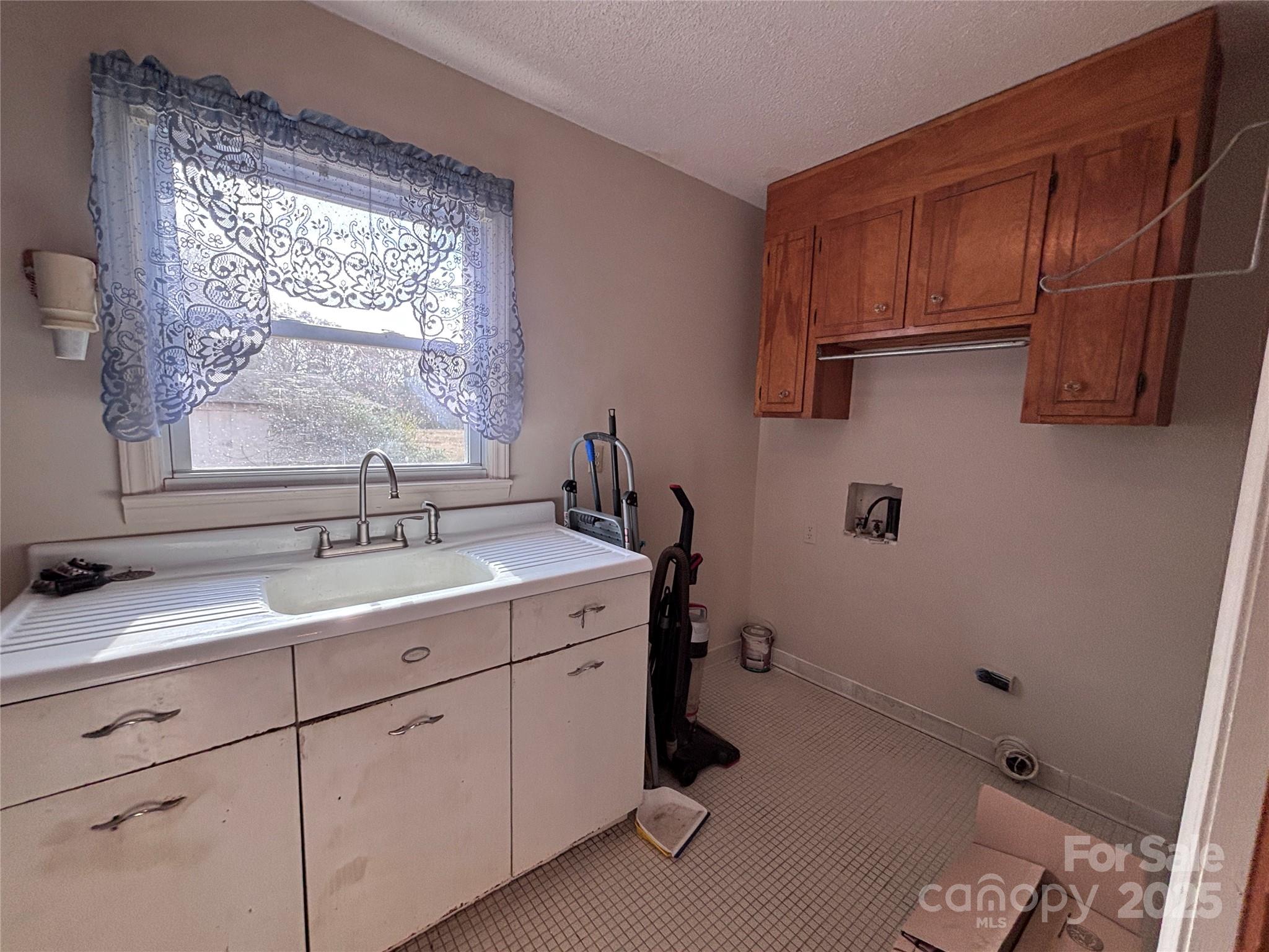 14740 Hatley-Burris Road Oakboro, NC 28129 - Photo 15 of 26 a bathroom with a sink and a mirror