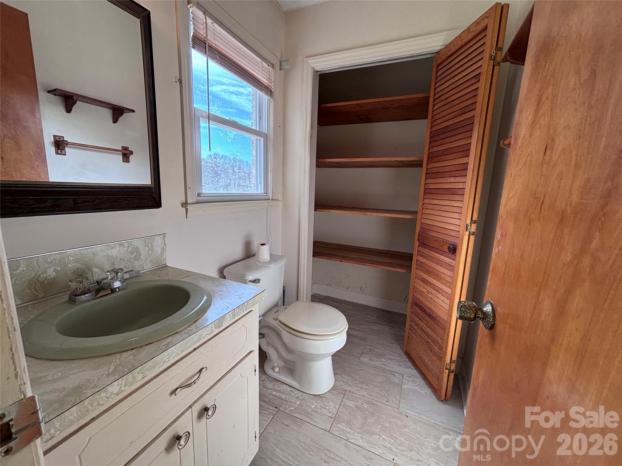 14740 Hatley-Burris Road Oakboro, NC 28129 - Photo 16 of 24 a bathroom with a sink toilet and shower