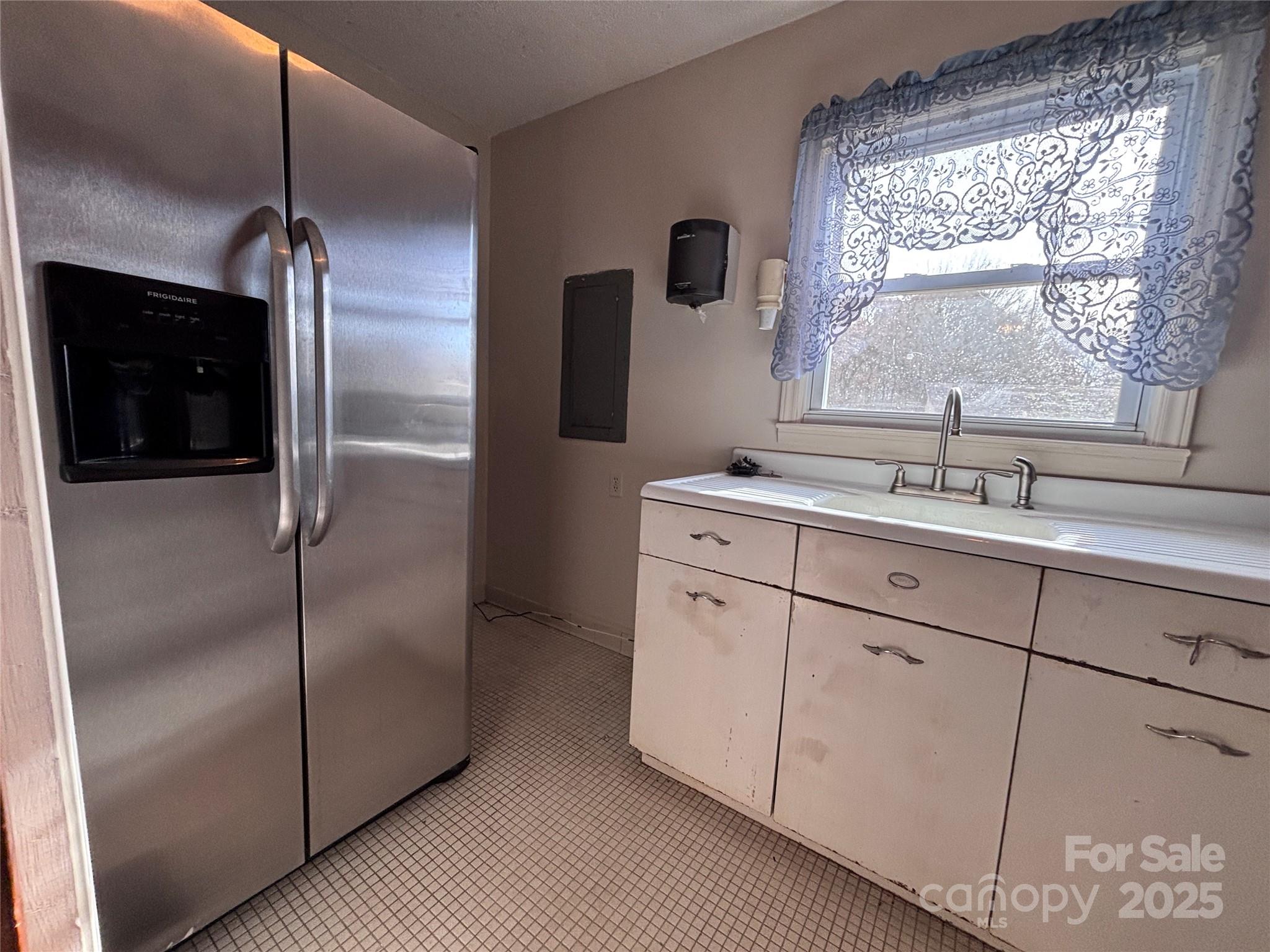 14740 Hatley-Burris Road Oakboro, NC 28129 - Photo 16 of 26 a kitchen with a refrigerator and a sink