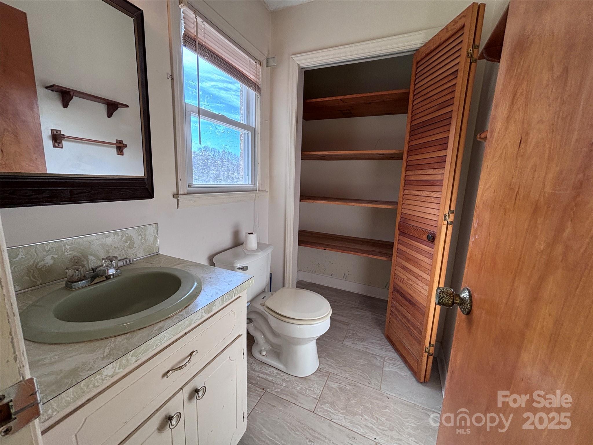 14740 Hatley-Burris Road Oakboro, NC 28129 - Photo 18 of 26 a bathroom with a sink toilet and shower
