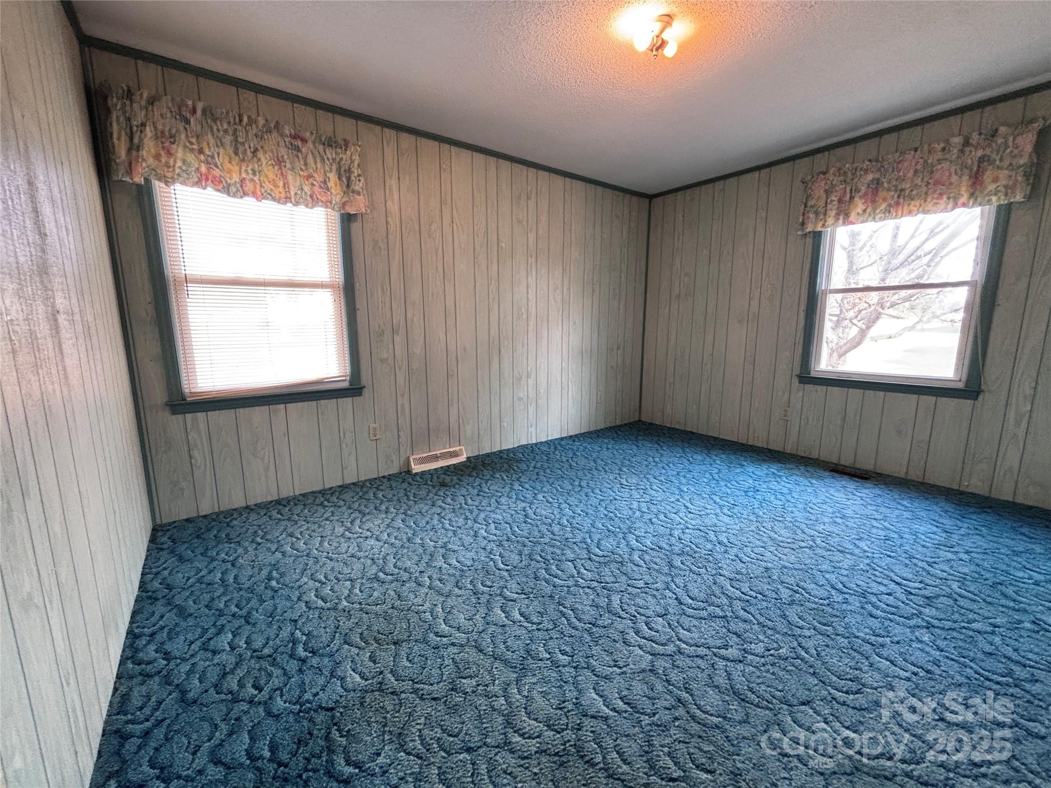 14740 Hatley-Burris Road Oakboro, NC 28129 - Photo 20 of 26 an empty room with a window