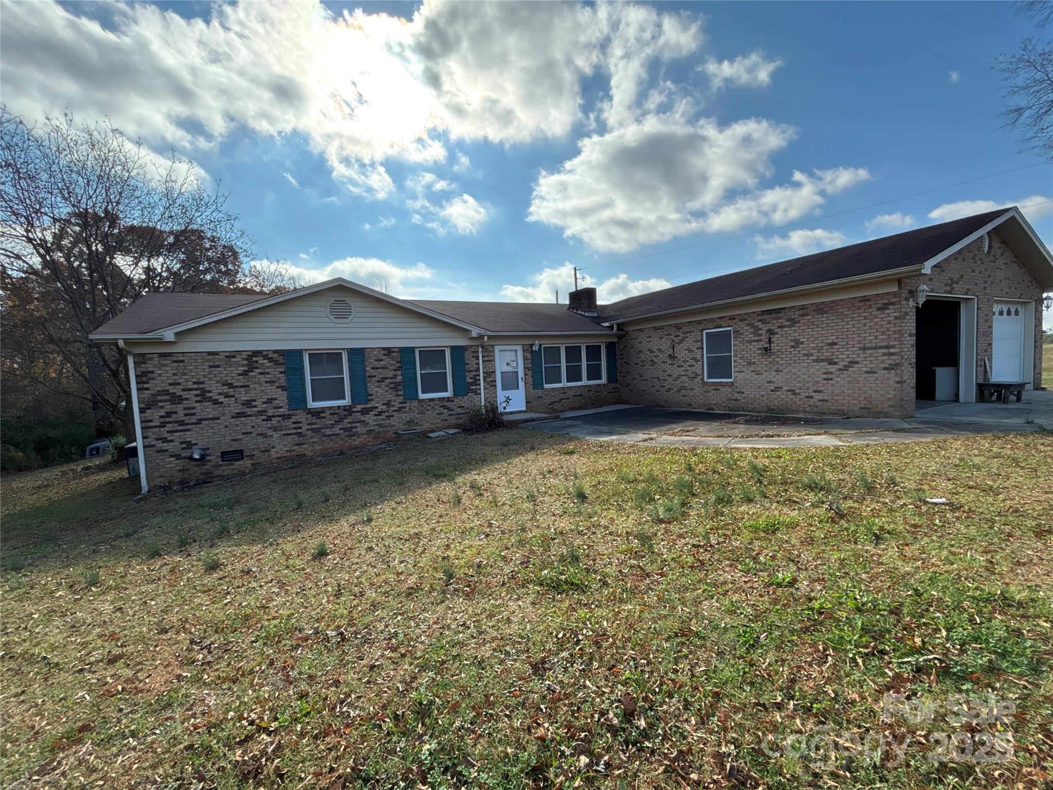 14740 Hatley-Burris Road Oakboro, NC 28129 - Photo 2 of 26 a view of a house with a yard