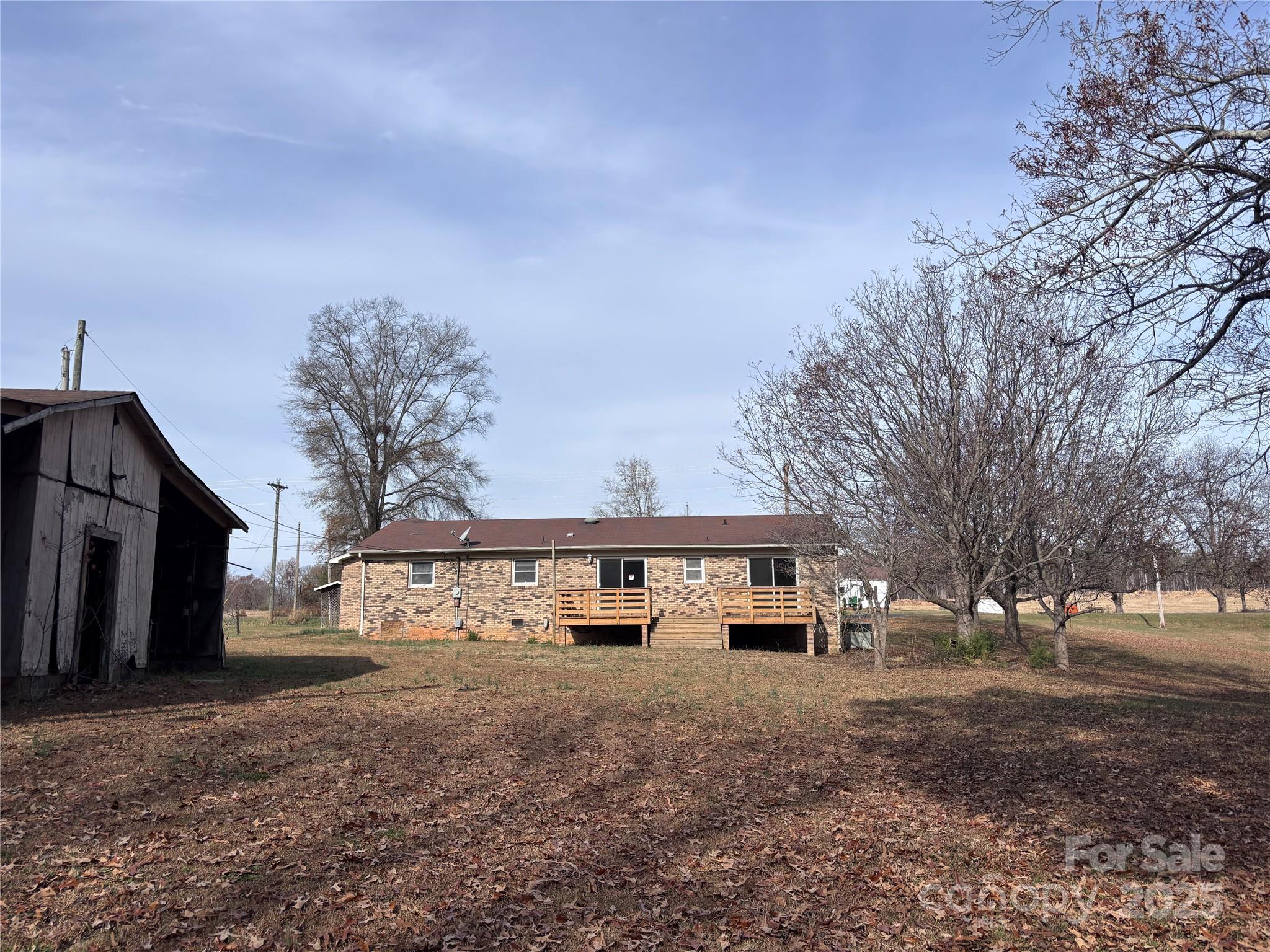 14740 Hatley-Burris Road Oakboro, NC 28129 - Photo 23 of 26 a front view of a house with a yard