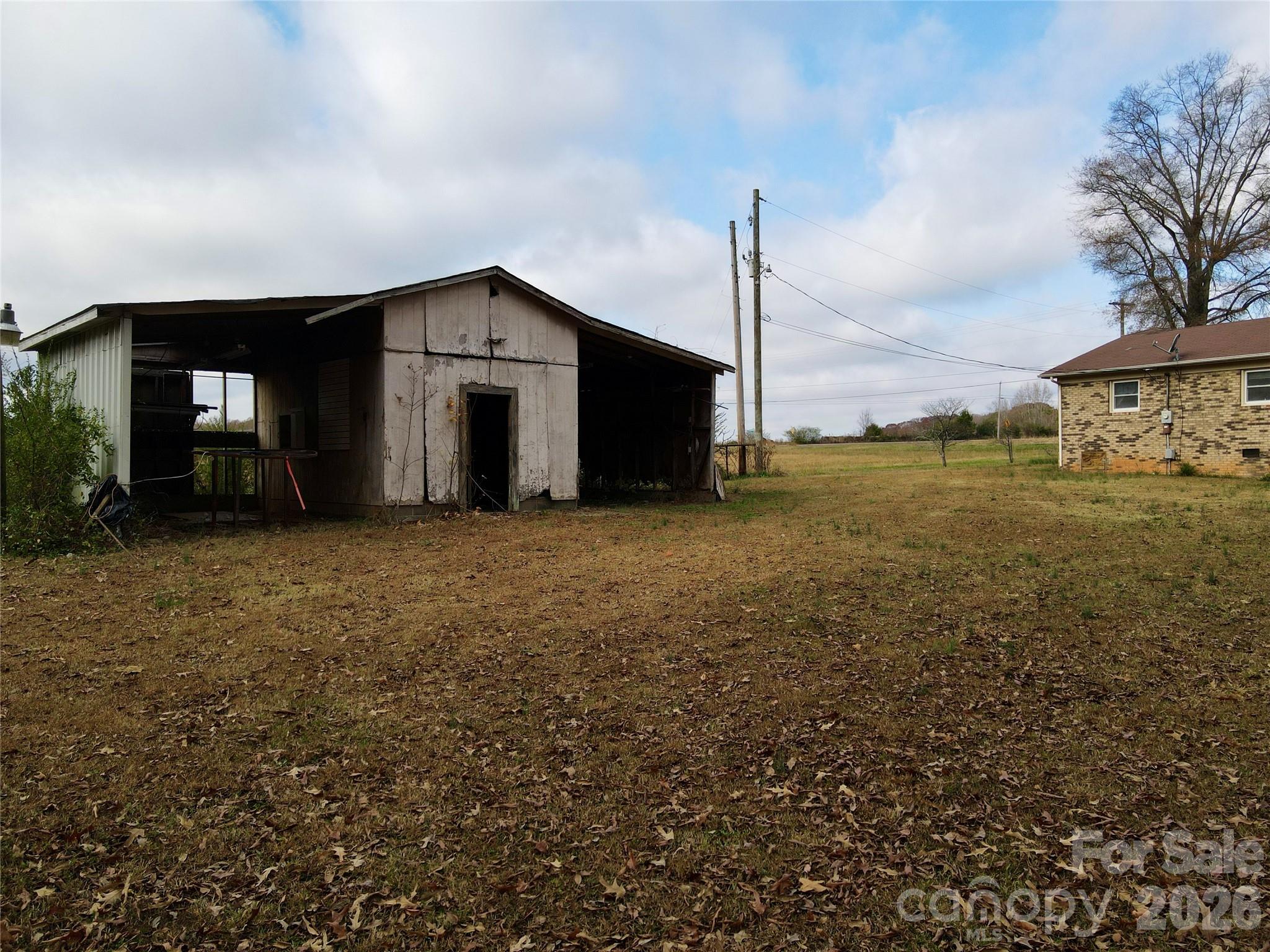 14740 Hatley-Burris Road Oakboro, NC 28129 - Photo 24 of 24 a big house with a big yard and large trees
