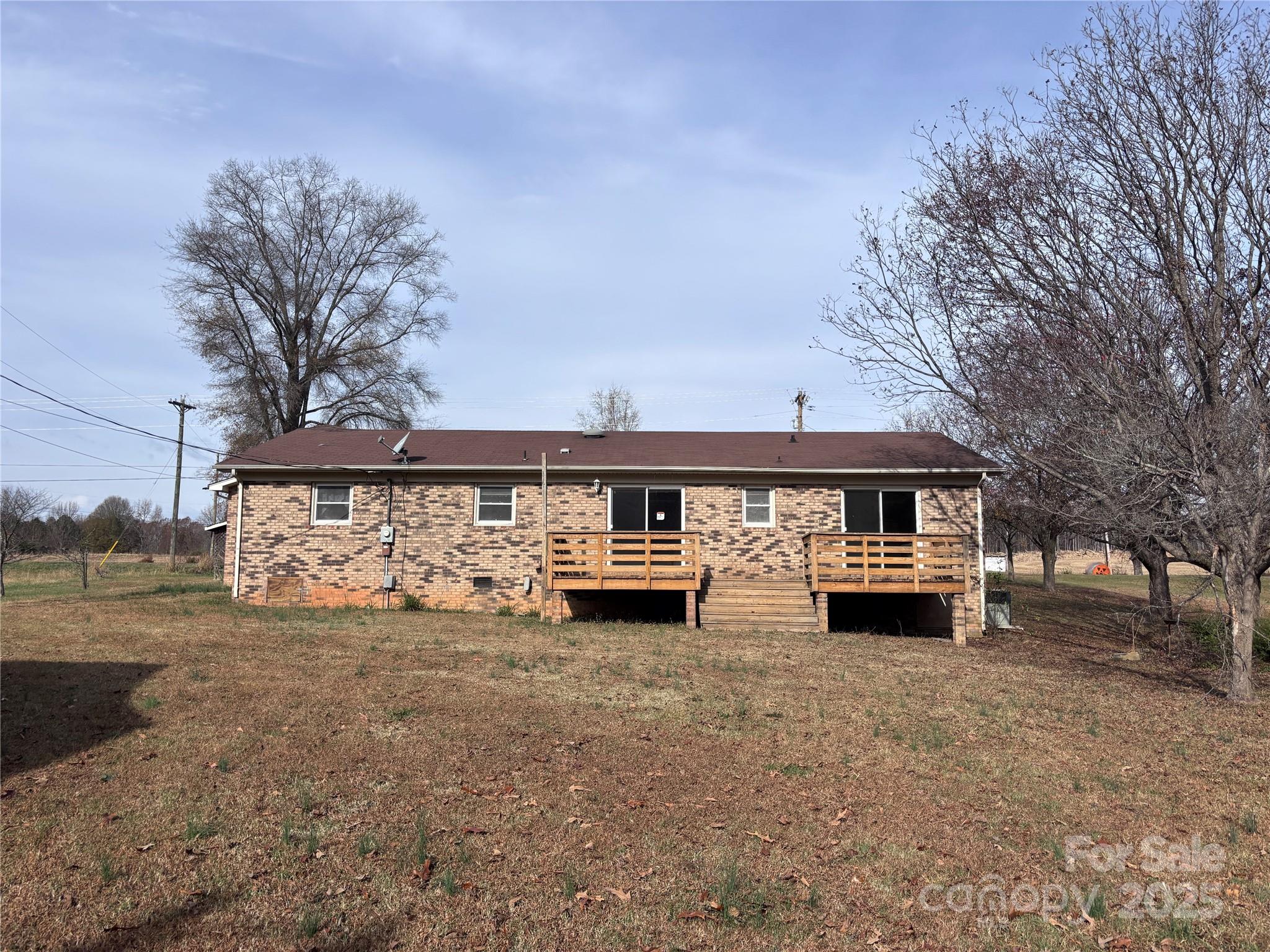 14740 Hatley-Burris Road Oakboro, NC 28129 - Photo 24 of 26 a view of a house with a yard and garage