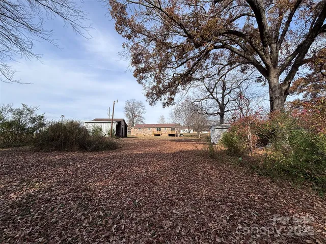 a view of a house with a yard and garage