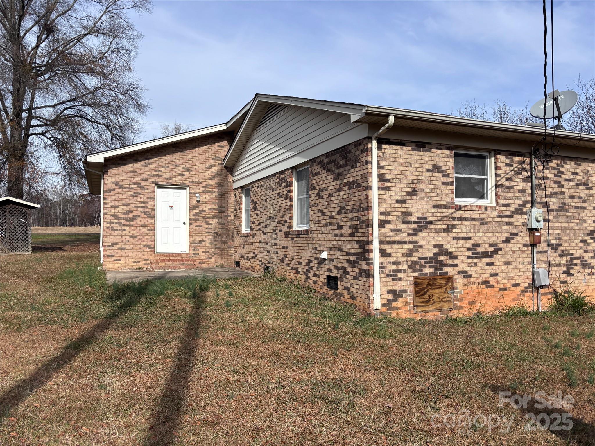 14740 Hatley-Burris Road Oakboro, NC 28129 - Photo 25 of 26 a view of a house with a outdoor space