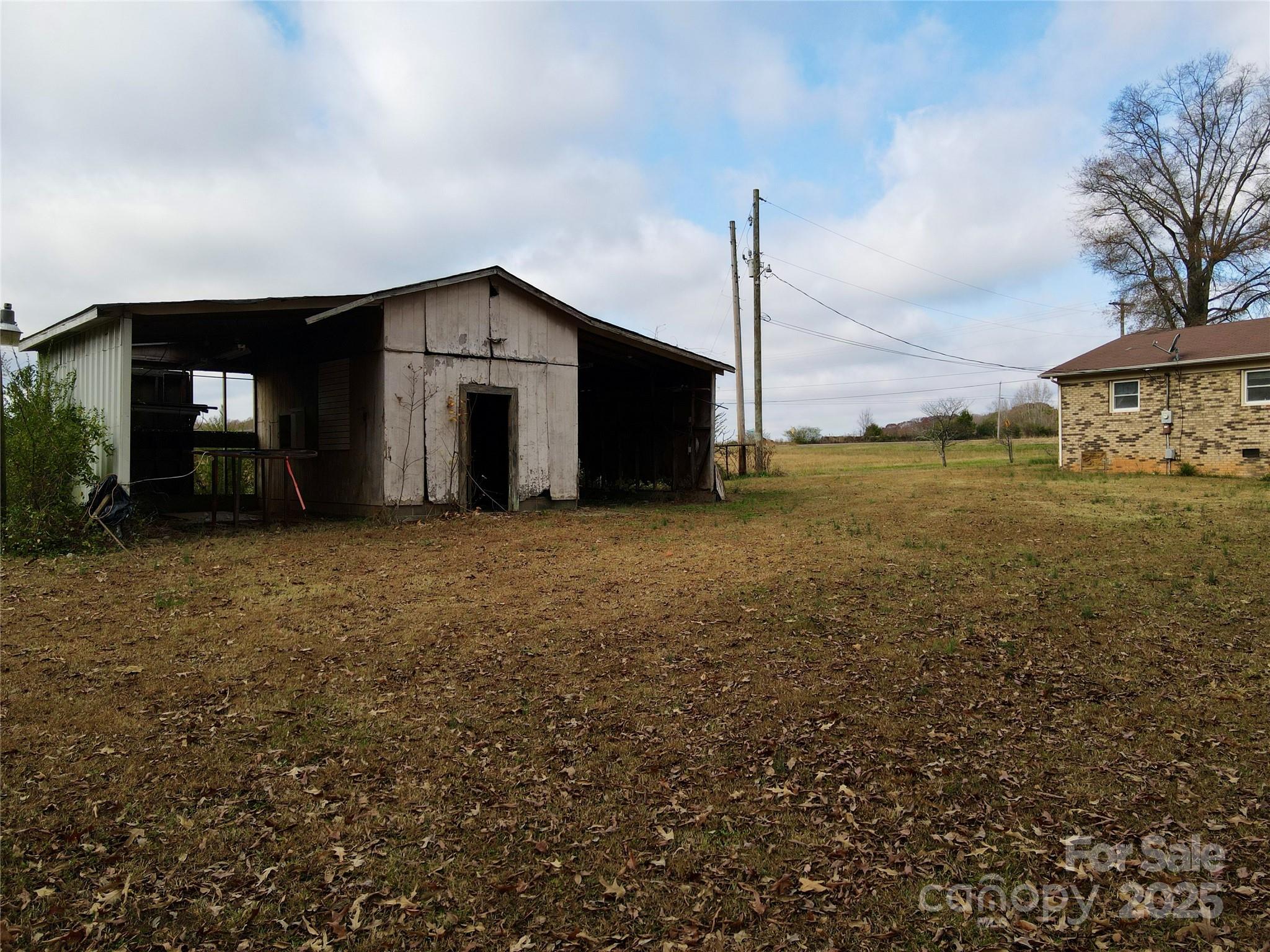 14740 Hatley-Burris Road Oakboro, NC 28129 - Photo 26 of 26 a big house with a big yard and large trees