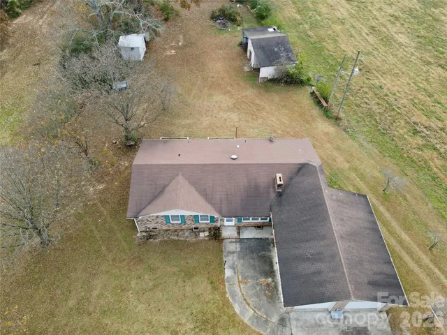 a view of a livingroom with a fireplace and window