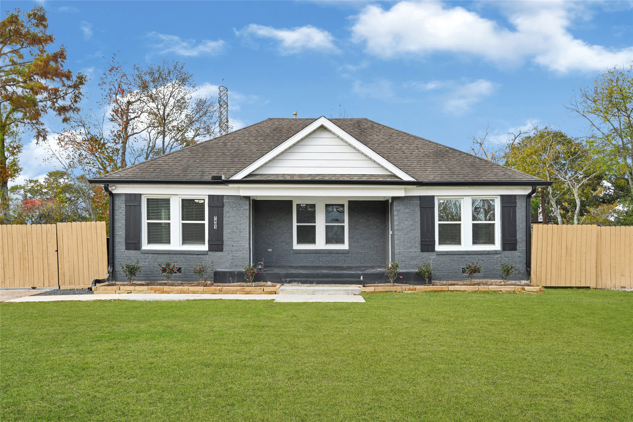 7403 Cayton Street Houston, TX 77061 - Photo 1 of 18 a front view of house with yard outdoor seating and barbeque oven