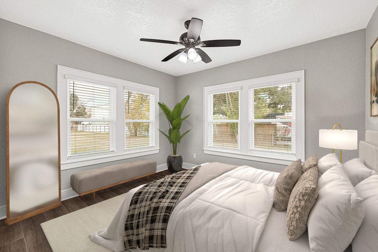 7403 Cayton Street Houston, TX 77061 - Photo 12 of 18 a bedroom with a large bed and a window