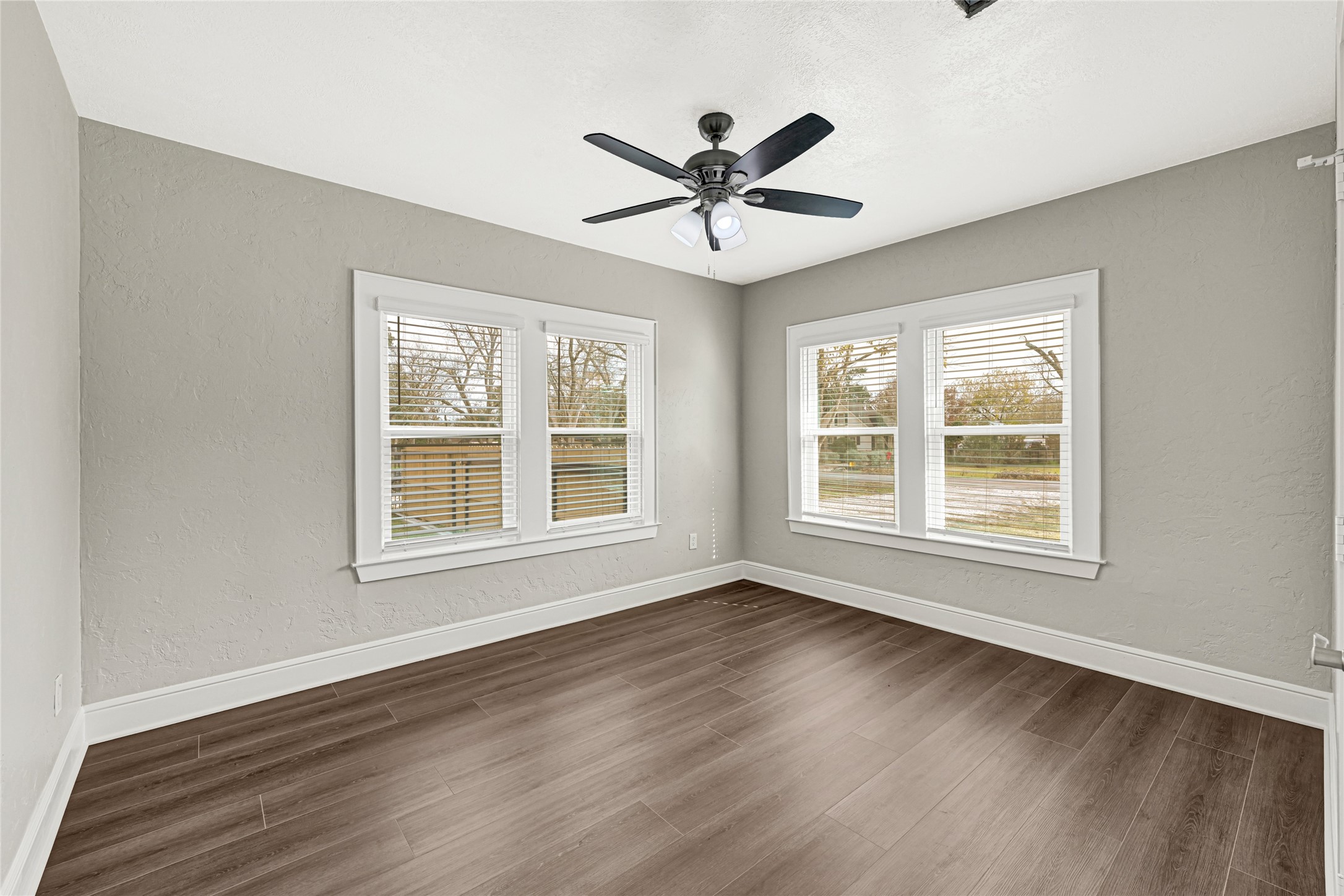 7403 Cayton Street Houston, TX 77061 - Photo 15 of 18 a view of an empty room with wooden floor and a window
