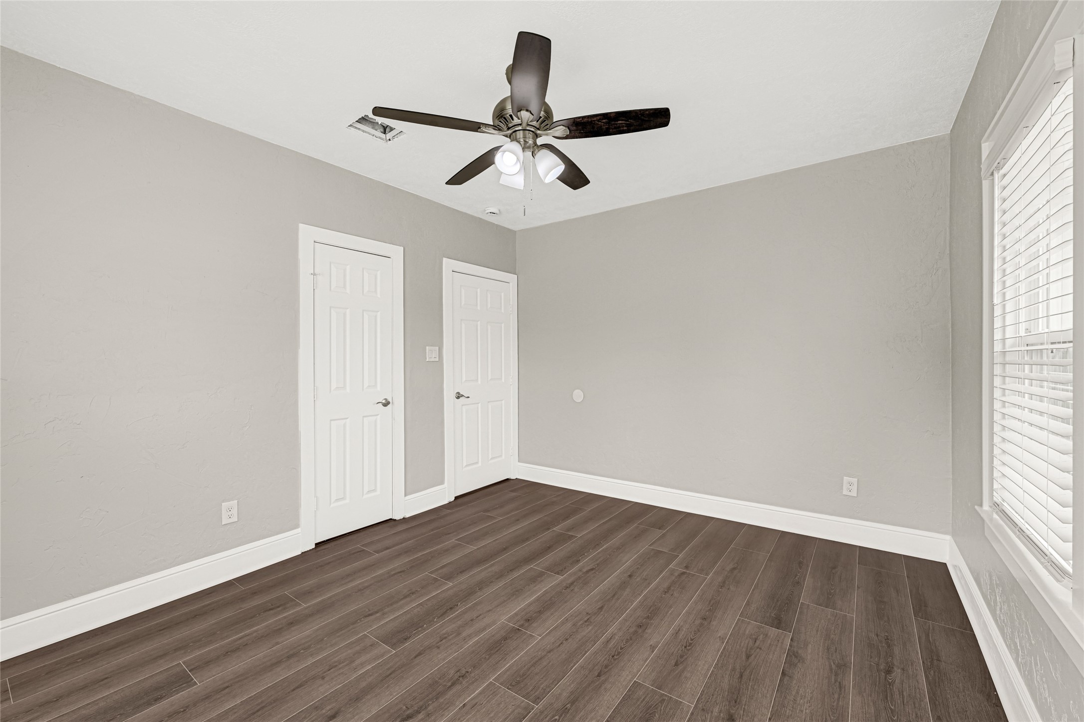 7403 Cayton Street Houston, TX 77061 - Photo 16 of 18 wooden floor in an empty room with a window