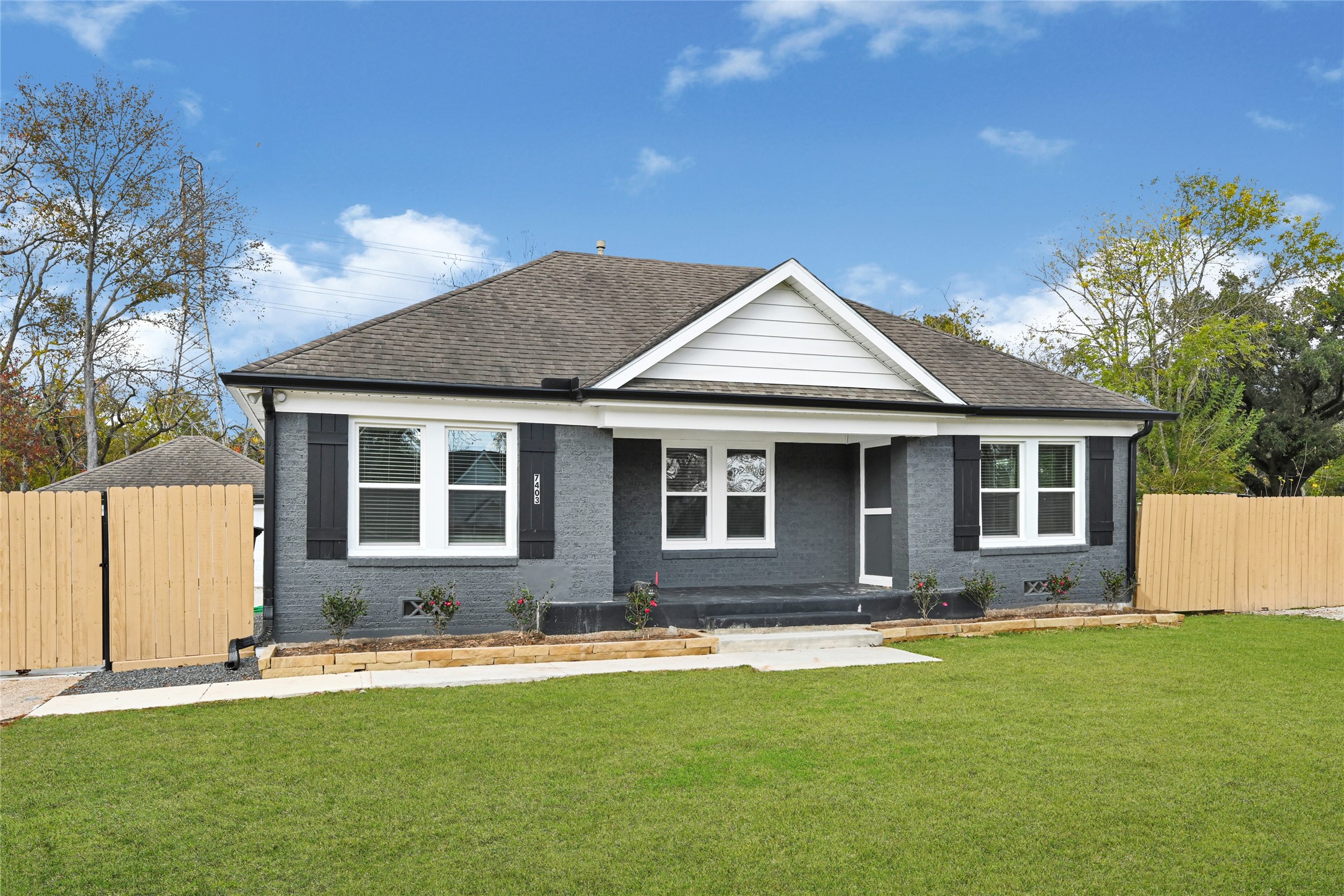 7403 Cayton Street Houston, TX 77061 - Photo 2 of 18 a front view of a house with a yard