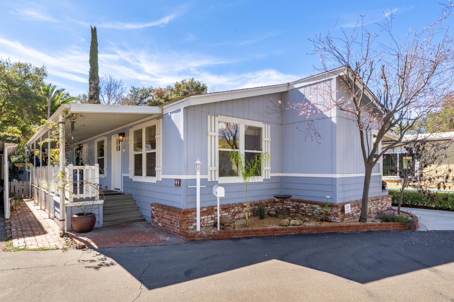 1273 South Rice Road, Unit 12 Ojai, CA 93023 - Photo 1 of 27 a front view of a house with garden