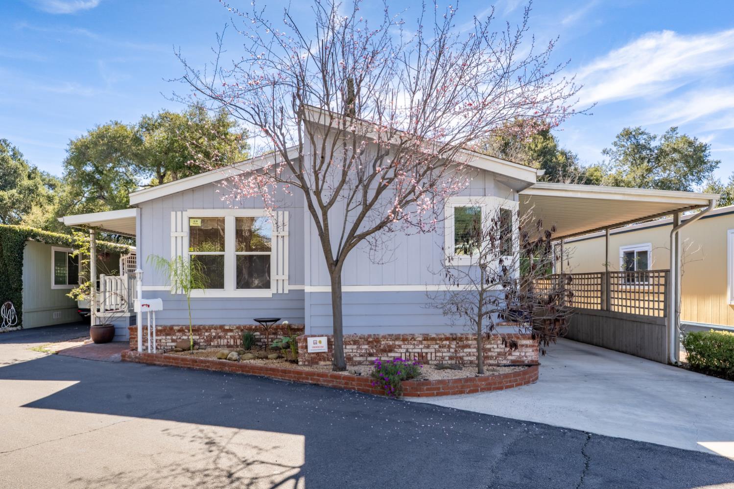 1273 South Rice Road, Unit 12 Ojai, CA 93023 - Photo 2 of 27 a front view of a house with garden