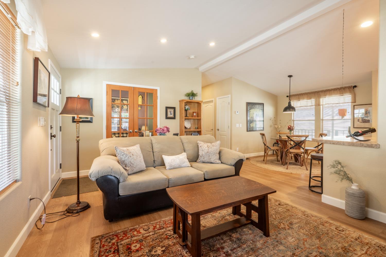 1273 South Rice Road, Unit 12 Ojai, CA 93023 - Photo 6 of 27 a living room with furniture potted plant and a large window
