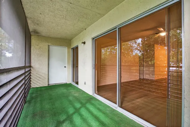a view of porch with a door