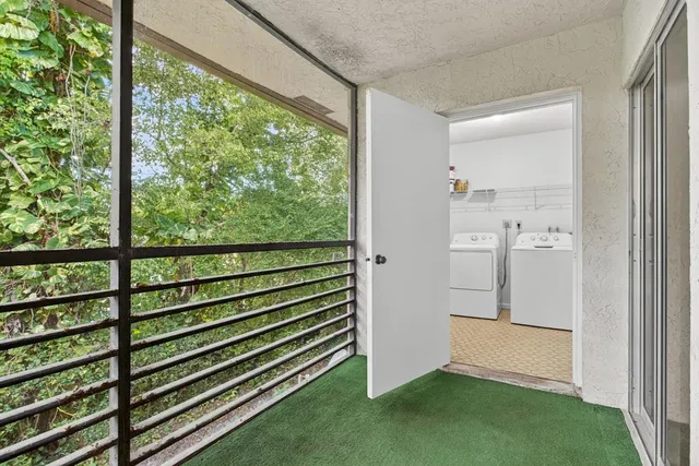 a view of a room that has a large window