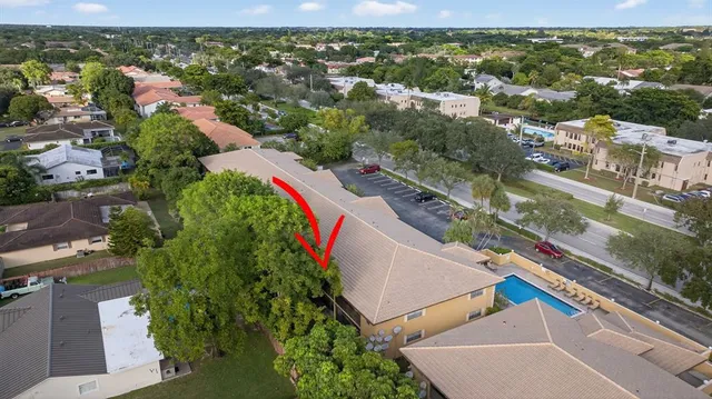 an aerial view of residential houses with outdoor space