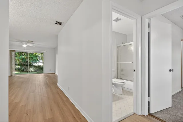 a view of a bathroom from the hallway