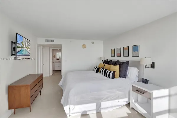 a bedroom with furniture and a couch