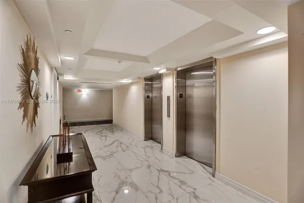 a bathroom with a glass shower door and a glass door