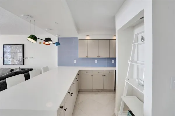 a bedroom with a bed and a cabinets
