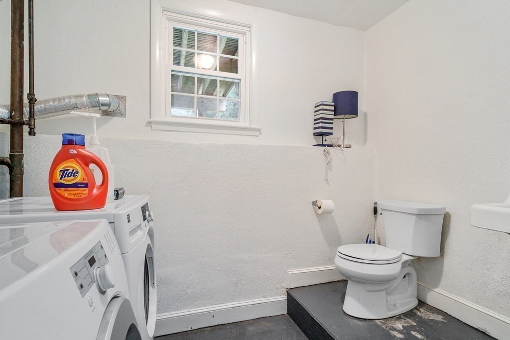 36 Putnam Road Bedford, MA 01730 - Photo 12 of 15 a bathroom with a toilet and a window